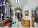 Spacious walk-in closet with shelving, hanging rods, and a decorative touch at 10809 Garden Mist Dr # 1042, Las Vegas, NV 89135