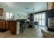 Dining room with tile flooring, large windows and a fireplace at 10949 Fintry Hills St, Las Vegas, NV 89141
