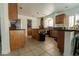 Spacious kitchen featuring stainless steel appliances, granite countertops, and a kitchen island at 10949 Fintry Hills St, Las Vegas, NV 89141