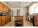 Spacious kitchen featuring stainless steel appliances, granite countertops, and an island at 10949 Fintry Hills St, Las Vegas, NV 89141