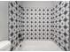 Stylish tub and shower combo features decorative star-burst tile at 1407 Dorothy Ave # 2, Las Vegas, NV 89119