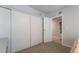 Bedroom with a large closet and a view into an adjoining room, perfect for a guest or  at 1407 Dorothy Ave # 2, Las Vegas, NV 89119