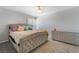 Cozy bedroom with neutral tones, a tufted headboard, and a light gray dresser at 1407 Dorothy Ave # 2, Las Vegas, NV 89119
