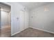 Bedroom with gray carpet and walls, featuring a closet with sliding doors at 1407 Dorothy Ave # 2, Las Vegas, NV 89119