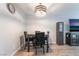 A stylish dining area features modern lighting and flows seamlessly into the living space at 1407 Dorothy Ave # 2, Las Vegas, NV 89119