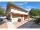 Desirable townhome showcasing private entrances, attached garages, and a neatly kept front yard at 1407 Dorothy Ave # 2, Las Vegas, NV 89119
