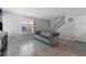 Stylish living room featuring hardwood floors, shutters on the windows and a staircase at 1407 Dorothy Ave # 2, Las Vegas, NV 89119