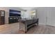 Modern living room featuring hardwood floors, shutters on the windows and a flat screen television at 1407 Dorothy Ave # 2, Las Vegas, NV 89119