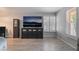 Bright living room features sleek floors, contemporary furniture, and shutters on the window at 1407 Dorothy Ave # 2, Las Vegas, NV 89119