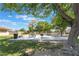 Shaded picnic area with multiple tables and benches, nestled among mature trees at 1407 Dorothy Ave # 2, Las Vegas, NV 89119