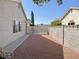 Backyard featuring a gravel area, a wall, and partial landscaping at 1441 Bronco Rd, Boulder City, NV 89005