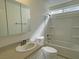 Bathroom featuring vanity, tub and shower combination, and natural lighting at 1441 Bronco Rd, Boulder City, NV 89005