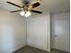 This bedroom features a ceiling fan and a standard closet at 1441 Bronco Rd, Boulder City, NV 89005