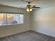 Bedroom with large window offering lots of natural light and ceiling fan at 1441 Bronco Rd, Boulder City, NV 89005