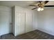 Bedroom featuring ceiling fan, carpet, and closet with sliding doors at 1441 Bronco Rd, Boulder City, NV 89005