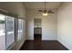 Bright dining room featuring wood floors, a ceiling fan and access to the backyard at 1441 Bronco Rd, Boulder City, NV 89005