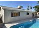 Exterior view of the house showing the pool and patio at 1441 Bronco Rd, Boulder City, NV 89005