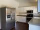 Bright kitchen features stainless steel appliances and white cabinetry at 1441 Bronco Rd, Boulder City, NV 89005