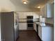 The kitchen features stainless steel appliances and white cabinetry at 1441 Bronco Rd, Boulder City, NV 89005
