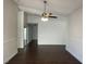 Spacious living room features wood floors and ceiling fan at 1441 Bronco Rd, Boulder City, NV 89005