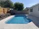 The pristine swimming pool is surrounded by lush landscaping at 1441 Bronco Rd, Boulder City, NV 89005