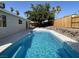 Enjoy this pool with landscaping, patio, and fence for privacy at 1441 Bronco Rd, Boulder City, NV 89005