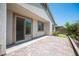 Charming home back patio with brick pavers and sliding glass door to the interior of the home at 1617 Meadow Bluffs Ave, Henderson, NV 89014