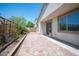 A charming backyard with a brick patio and garden space, perfect for outdoor enjoyment and gardening at 1617 Meadow Bluffs Ave, Henderson, NV 89014