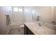 Bathroom showcasing granite countertops, a sink, a white tiled shower, and modern fixtures at 1617 Meadow Bluffs Ave, Henderson, NV 89014