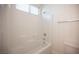 Bright bathroom featuring a bathtub with white tile and a shower head, offering a relaxing space at 1617 Meadow Bluffs Ave, Henderson, NV 89014