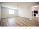 A spacious bedroom with modern flooring, fan, and window for ample natural light at 1617 Meadow Bluffs Ave, Henderson, NV 89014