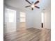 Bedroom with ceiling fan, adjoining bath and walk-in closet at 1617 Meadow Bluffs Ave, Henderson, NV 89014