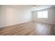 This bedroom offers wood flooring and is bathed in natural light from the window at 1617 Meadow Bluffs Ave, Henderson, NV 89014