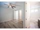 Bedroom with ceiling fan and adjoining bathroom at 1617 Meadow Bluffs Ave, Henderson, NV 89014