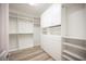 Expansive walk-in closet with custom shelving, drawers, and ample storage space at 1617 Meadow Bluffs Ave, Henderson, NV 89014