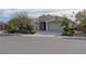 Charming single-story home with a well-maintained front yard and two-car garage at 1617 Meadow Bluffs Ave, Henderson, NV 89014