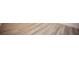 Close up of the hardwood flooring in a neutral color tone with light wood grain at 1617 Meadow Bluffs Ave, Henderson, NV 89014