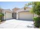 Charming home with stone accents, a 3-car garage, and a well-maintained landscaped front yard at 1617 Meadow Bluffs Ave, Henderson, NV 89014