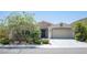Charming single-story home with stone accents, a two-car garage, and a well-maintained landscaped front yard at 1617 Meadow Bluffs Ave, Henderson, NV 89014