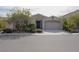 Charming single-story home with a well-maintained front yard and two-car garage at 1617 Meadow Bluffs Ave, Henderson, NV 89014