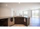 Kitchen island with stainless dishwasher, sink and faucet with backyard views at 1617 Meadow Bluffs Ave, Henderson, NV 89014