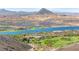 Panoramic view showcasing a community, a golf course, and the lake at 163 Caraset Ln, Henderson, NV 89011