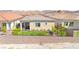 A private backyard featuring synthetic grass and desert landscaping at 163 Caraset Ln, Henderson, NV 89011