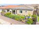 A fully fenced backyard with a covered patio and desert landscaping at 163 Caraset Ln, Henderson, NV 89011