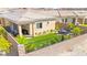 Landscaped backyard with artificial turf, patio, and mountain views at 163 Caraset Ln, Henderson, NV 89011