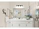 Modern bathroom with quartz countertop vanity, stylish mirror, and a glass-enclosed shower at 163 Caraset Ln, Henderson, NV 89011