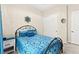 Charming bedroom with blue accents, plush bedding, and closet at 163 Caraset Ln, Henderson, NV 89011