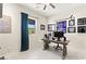 Office space with large window, ceiling fan and wood desk with views of the outside at 163 Caraset Ln, Henderson, NV 89011
