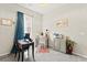 Charming bedroom with a work desk, bright window with natural light, and cozy carpet at 163 Caraset Ln, Henderson, NV 89011