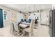 Open dining area features stylish seating, and view of the kitchen at 163 Caraset Ln, Henderson, NV 89011